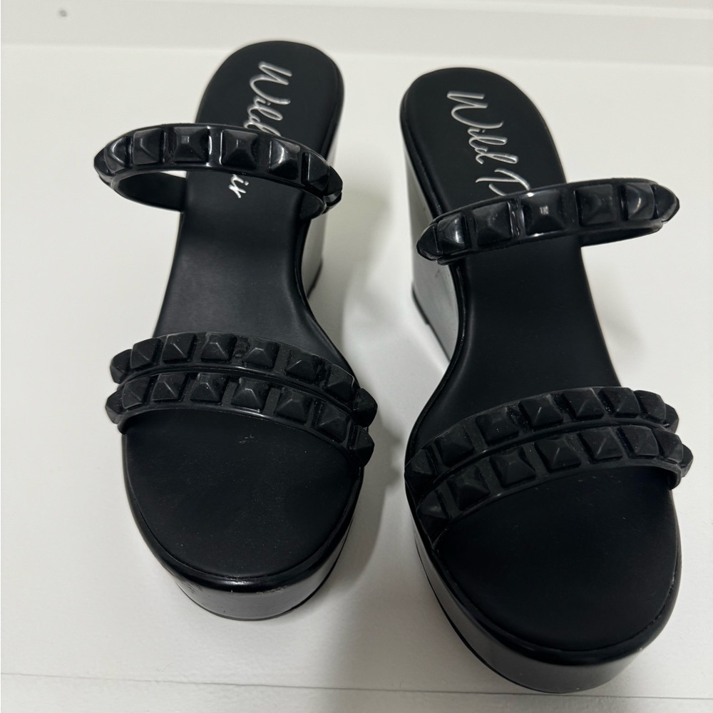 Black wedges, sporty yet trendy. Size 6. Wore once, practically new.